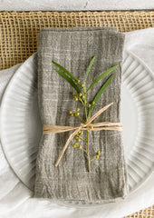 A napkin on a fluted plate.