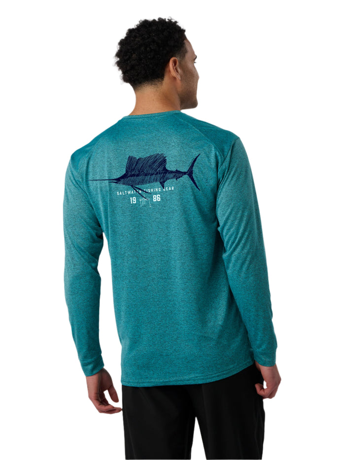 Man wearing a teal long-sleeve shirt with a fish graphic on the back against a white background