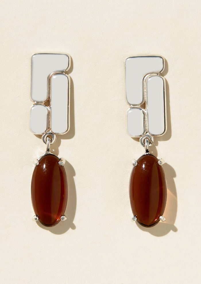 A pair of sterling silver drop earrings with brown glass cabochons.
