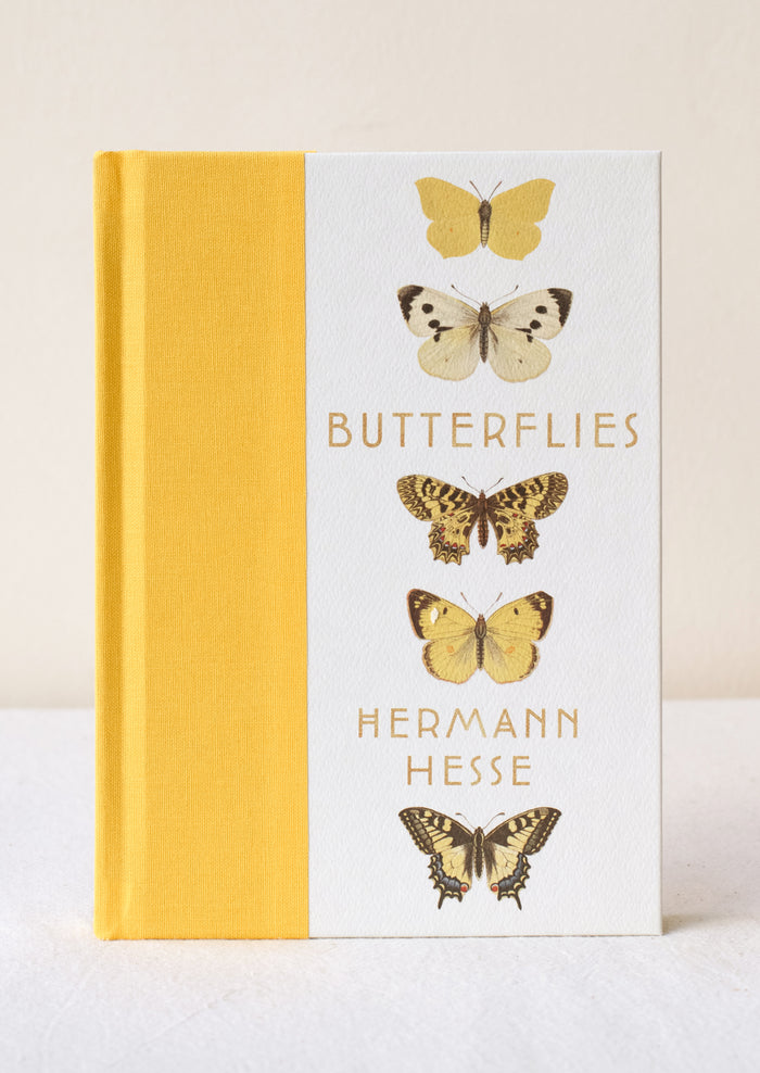 A hardcover book titled "Butterflies" with yellow cloth bound spine.