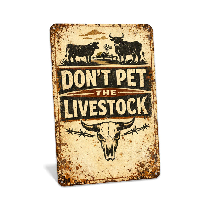 Rustic metal sign reading “Don’t Pet Livestock” in bold western lettering, distressed ranch and farmhouse wall décor.