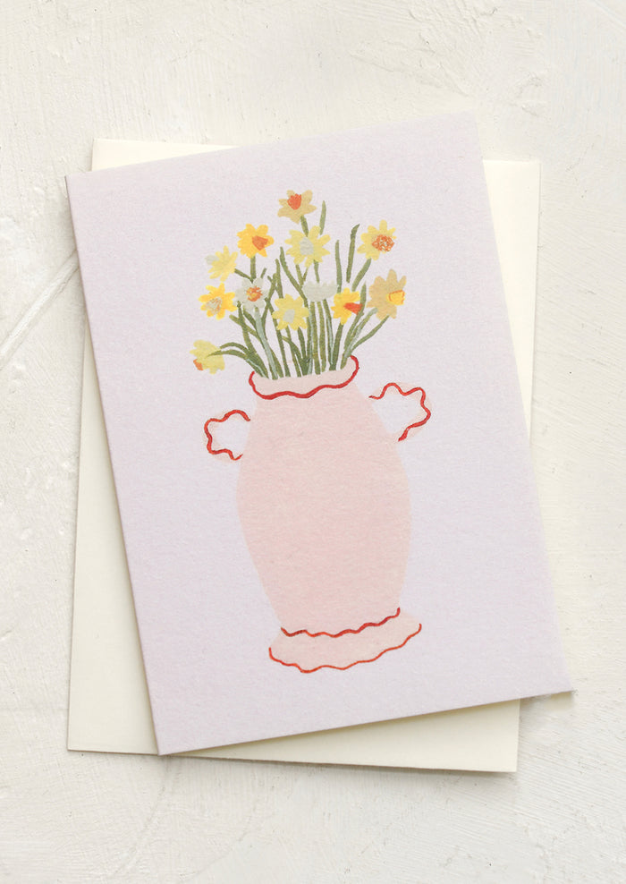 A mini greeting card in pastel purple with illustration of daffodils in vase.