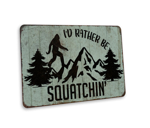 Funny rustic metal I'd Rather Be Squachin Bigfoot sign for cabin, camper or yard decor