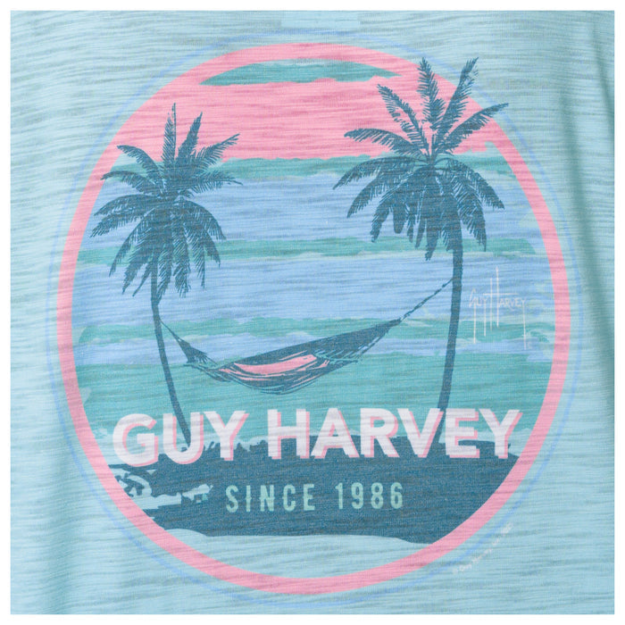 Guy Harvey logo with palm trees and a hammock on a blue background