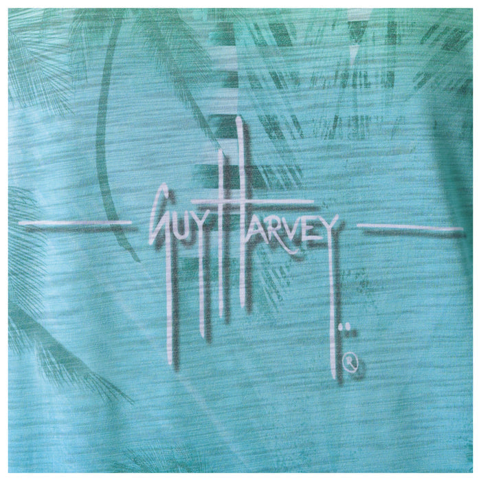 Guy Harvey logo on a textured teal background
