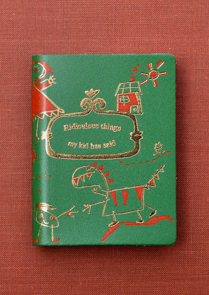 A green notebook reading "Ridiculous things my kid has said" on cover.