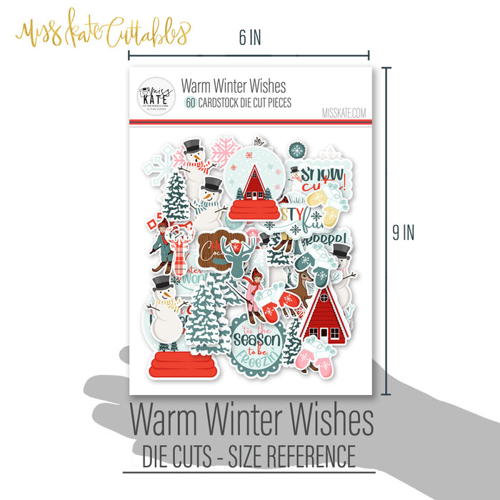 Warm Winter Wishes Die Cuts, size guide shown in hand for scale, showing pre-cut scrapbook embellishments for layouts, handmade cards, journals, mini albums, memory pages, and layered paper crafts. Buyer theme: Winter Die Cuts & Snow Day Embellishments. Warm Winter Wishes Die Cuts with snowmen, snow globes, skiers, evergreen trees, deer, mittens, cocoa mugs, cabins, snowflakes and winter titles. Coordinating patterns include Snowflake scatters, Evergreen tree repeats, Winter berry branches