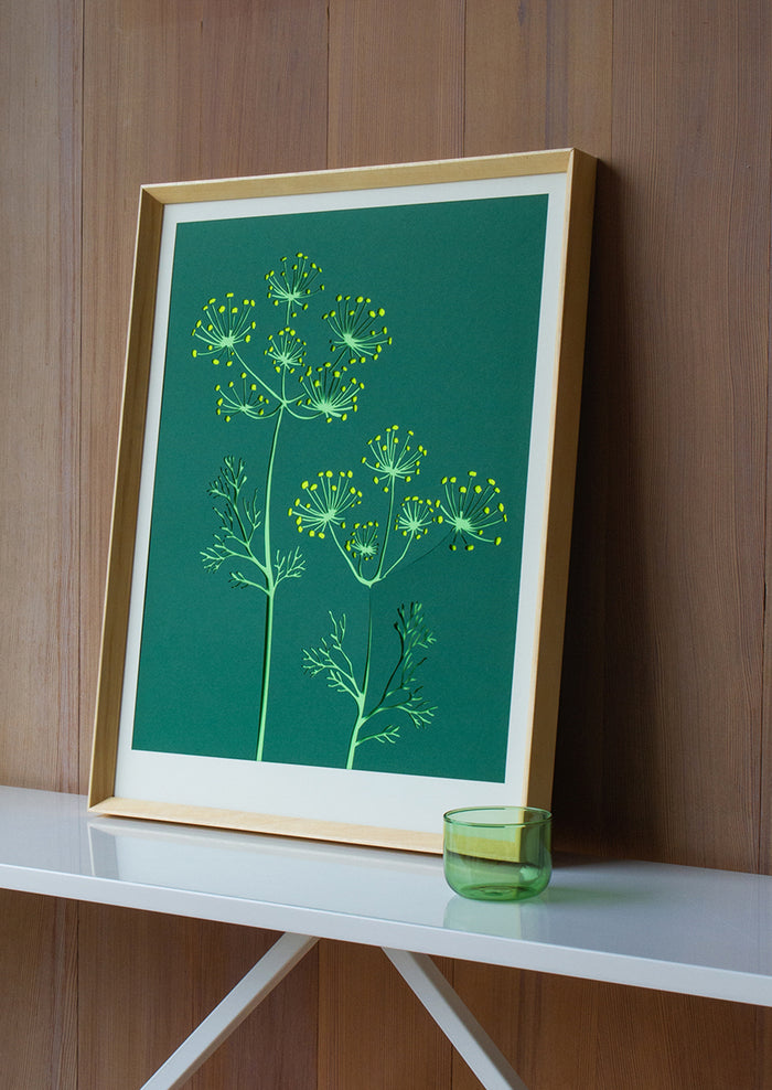 A lasercut art print depicting fennel flowers on dark green background.